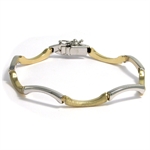 B�lgeformet 14 karat 2 farvet guld armring