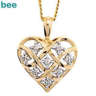 Guld hjerte vedh�ng med 8 x 0,005 ct diamant