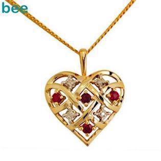 Guld hjerte vedh�ng med 4 x 0,005 ct diamant og 4 x rubiner