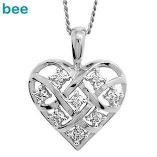 9 kt hvidgulds hjerte med 8 x 0,005 ct diamant