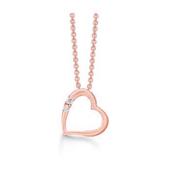Støvring Design's smukke rosa forgyldte sølv kæde med "skævt" hjerte vedhæng med glitrende hvid zirkonia på den ene halvdel, leveres med 42 + 3 cm kæde