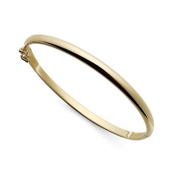 Smuk enkel og elegant armring i 18 karat guld. Oval ring med pavé overflade som kan åbnes. fra Svedbom