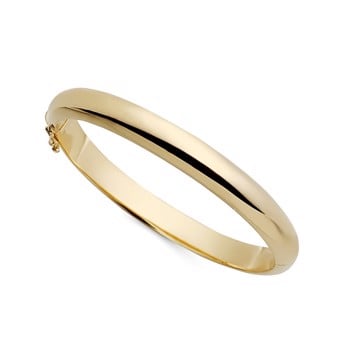 Smuk enkel og elegant armring i 18 karat guld. Oval ring med pavé overflade som kan åbnes. fra Svedbom