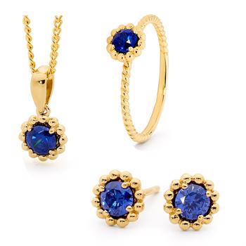 Romantisk guld mini blomster smykkesæt med blå zirkonia og 45 cm forgyldt kæde fra Bee Jewelry