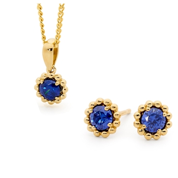 Romantisk guld mini blomster ørestikker og vedhæng med blå zirkonia og 45 cm forgyldt kæde fra Bee Jewelry
