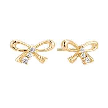 Sølvforgyldte ørestikker fra Støvring Design, formet som sløjfer med klare sten.