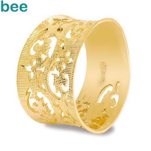 Image of Bred guld fingerring med blomster udskæringer